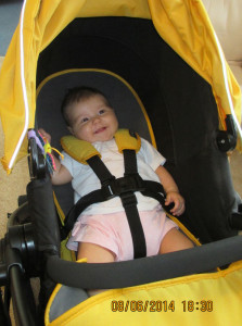 Freya in her pram, ready for an outing.